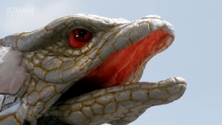 Mikoto, the metallic snake kaiju in Ultraman Omega Episode 5, crying in grief after realizing his bond with Miko is harming her