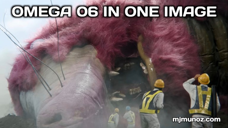 Workers in protective gear stand near the face of a large kaiju lying motionless