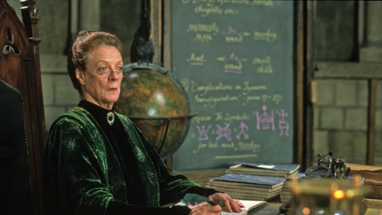 Professor McGonagall seated at her desk in Harry Potter and the Philosopher’s Stone, representing adult authority, structure, and care at Hogwarts.
