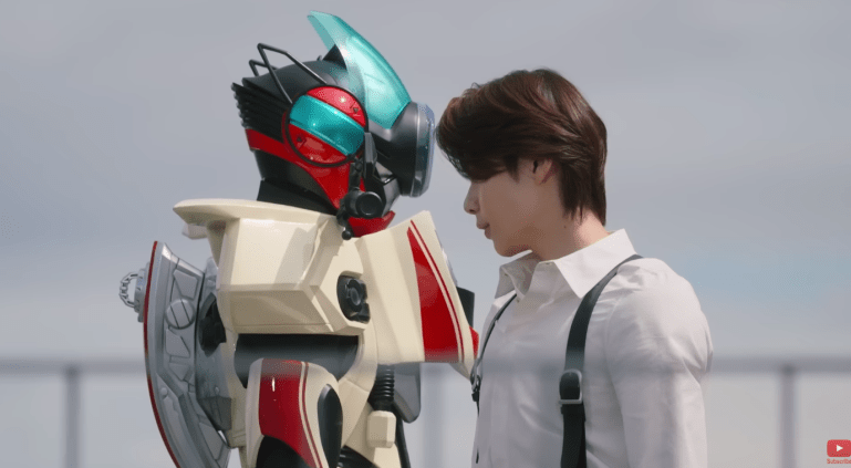 Baku standing face to face with Zero in Kamen Rider Zeztz Episode 16 during a moment of confrontation and mistrust