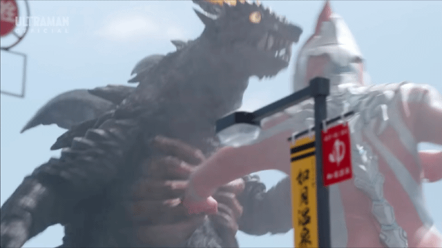 Ultraman Omega repeatedly punching the kaiju Demaaga during a fight scene in Ultraman Omega Episode 10.