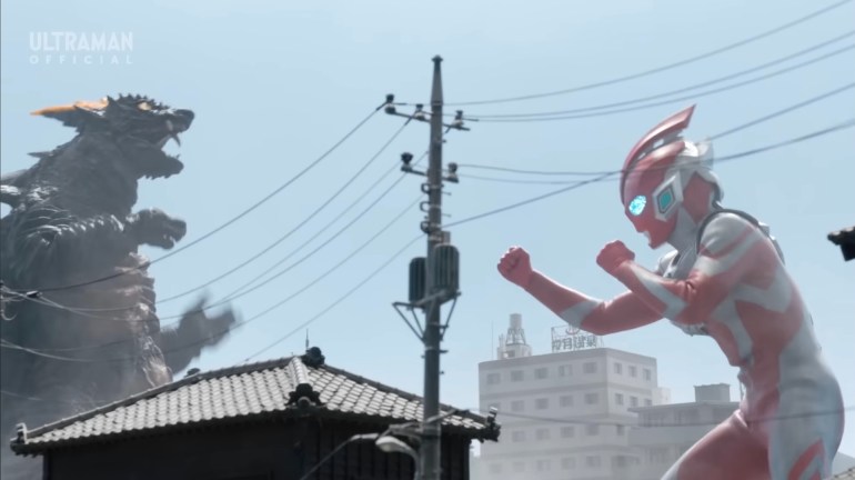 Ultraman Omega raises his fists and prepares to fight the kaiju Demaaga in Ultraman Omega Episode 10.