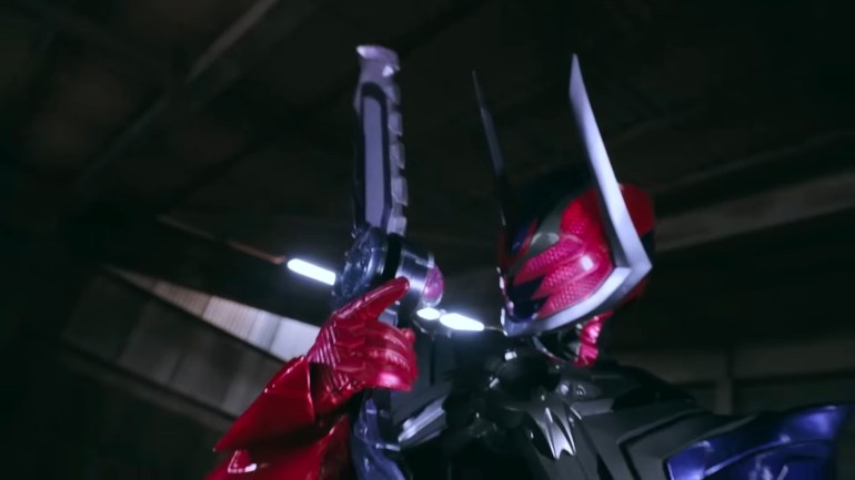 Kamen Rider Dawn appearing at the end of Kamen Rider Zeztz Episode 26 holding twin blades and launching an attack during the dream world standoff.