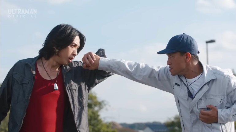 Sorato confronts Zovaras in human form during a close quarters fight in Ultraman Omega Episode 14. The two alien rivals clash before transforming, highlighting the episode's rare civilian scale combat sequence.