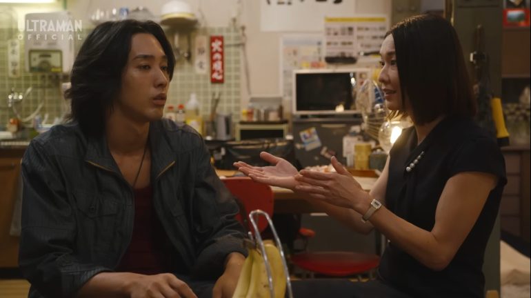 Sorato speaks with Professor Sayuki Uta at Taiyo Warehouse in Ultraman Omega Episode 14. The brilliant kaiju researcher questions Omega's true intentions while gathering information about the mysterious giant of light.
