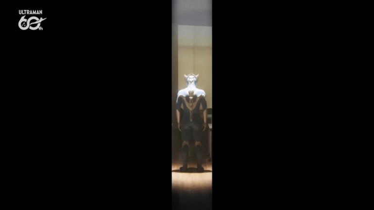 Ultraman Teo stands alone in a narrow shaft of light framed by darkness during a symbolic scene in Episode 1.
