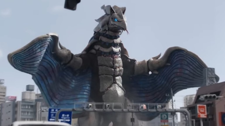 Sodera, the giant moth-like kaiju from Ultraman Teo Episode 2, spreads its enormous blue wings over the city.