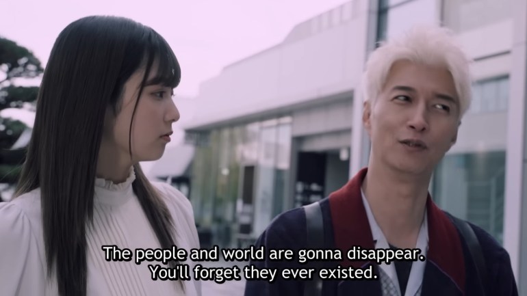 Nem speaks with Sieg as he explains that the people she forgets will disappear in Kamen Rider Zeztz Episode 44, "Efface."