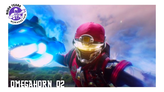 Shout in his powered suit raises his arm as blue energy and glowing effects surround him during battle.