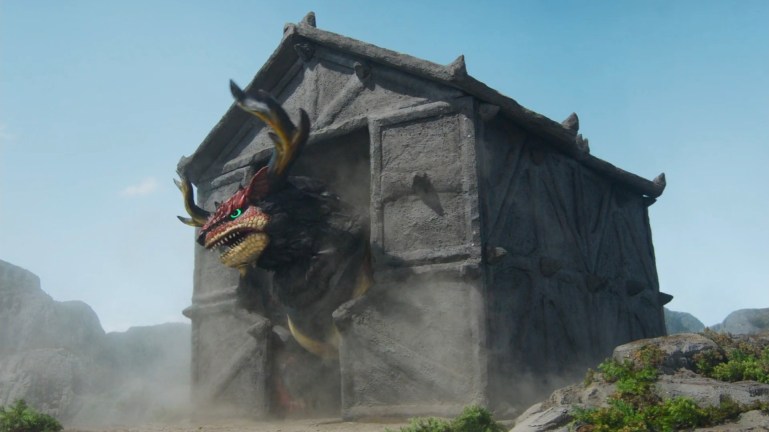 Enkaku pushes through a stone-like prison formed from giant energy shields created by the scammer's powers.