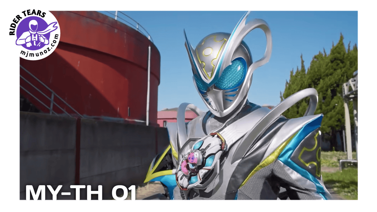 Kamen Rider My-Th stands outdoors in his silver, blue, and black mouse-themed Rider suit.